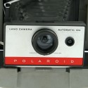 Polaroid camera 104