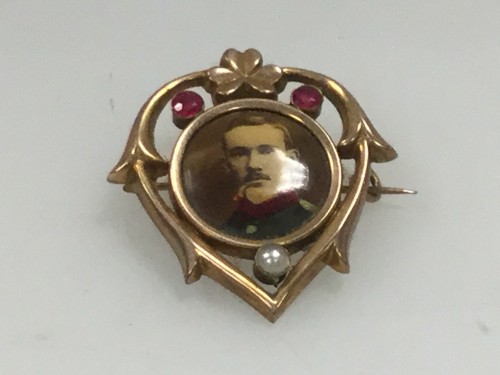 Miniature bronze brooch