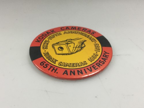 Pin commemorating 65 years