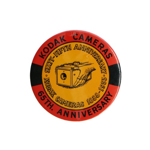 Pin commemorating 65 years