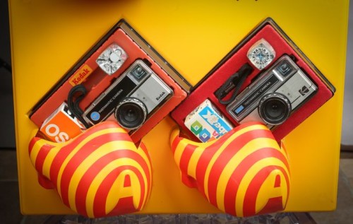 Exhibitor kodak instamatic cameras with three enclosures